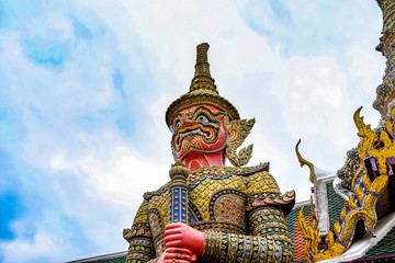 Obraz premium Wat Phra Kaew, or the Temple of the Emerald Buddha and Officially as Wat Phra Si Rattana Satsadaram, is regarded as the most sacred Buddhist temple in Bangkok Thailand,symbol Giant statue.