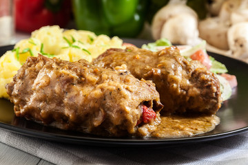 Pork rolls in sauce