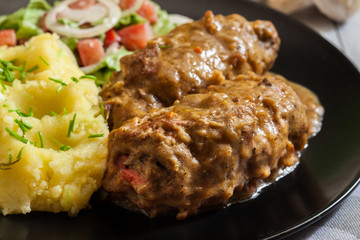 Pork rolls in sauce