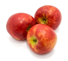 Three whole red Kanzi apples isolated on white background