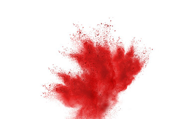 Splash of red powder over white background.