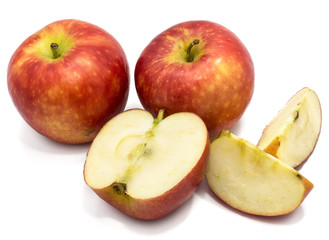 Naklejka na ściany i meble Two whole Kanzi apples, one half, two slices, isolated on white background