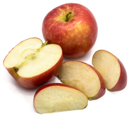 One whole Kanzi apple, one half, three slices, isolated on white background