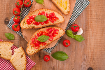 Bruschetta bread with basil and chopped tomatoes. 