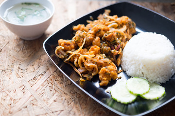 Rice with spicy fried chicken salad