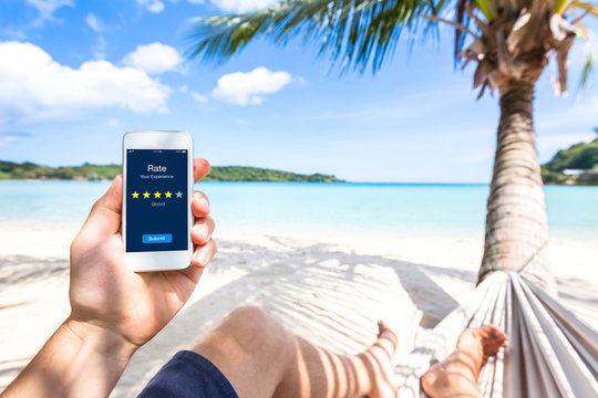 Customer review on smartphone screen, rate experience, feedback, stars, beach