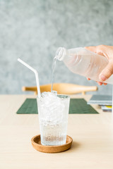 pouring water in glass