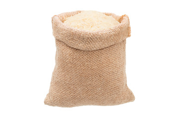 White rice in burlap sack bag isolated on white background