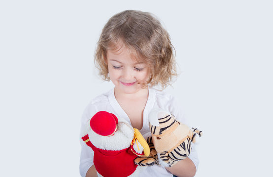five year old girl with plush puppets