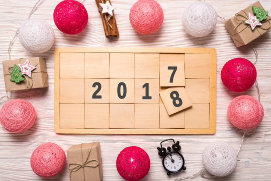 Mew Year changing 2017 2018, wooden blocks, five minutes before midnight - Powered by Adobe