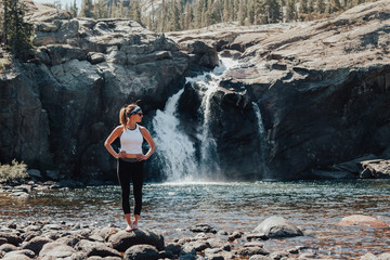Standing in front of Glen Aulin waterfall in Yosemite National Park