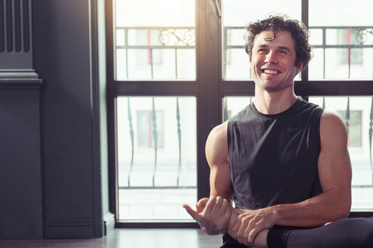 Portrait of Young yoga teacher smiling after meditating and doing yoga