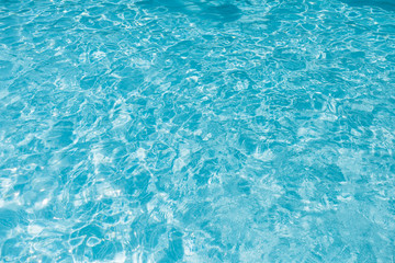 Fototapeta premium Blue and bright ripple water and surface in swimming pool , Beautiful motion gentle wave in pool