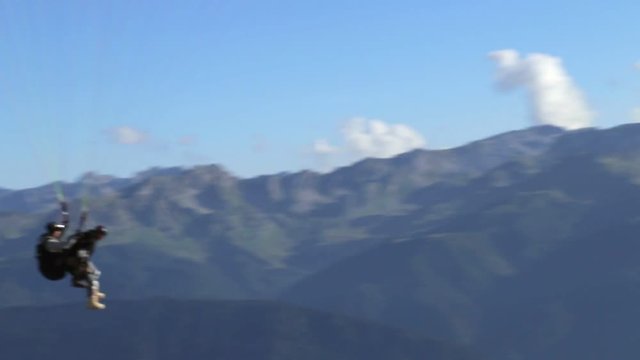 Following Parachute silhouette the mountains