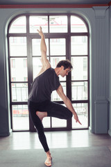 Fototapeta na wymiar Man performing yoga indoors