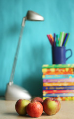 Education accessories with pencils? lamp and apple
