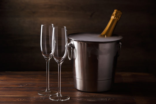 Picture of two empty wine glasses, iron bucket