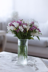 Flowers on white table in room