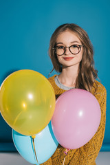 Fototapeta na wymiar stylish teenage girl with balloons