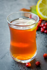 Apple cranberry slow cooker tea. Selective focus, close up, copy space.