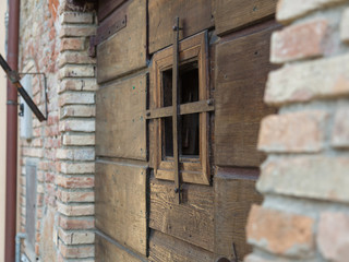Close-up of Ancient Brown Wooden Door with Opening