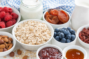 oat flakes and various delicious ingredients for breakfast, close-up