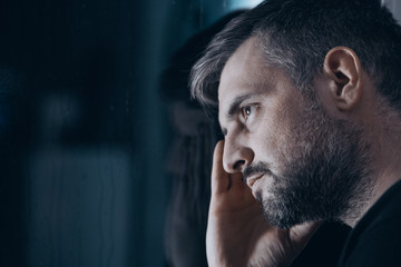 Thoughtful man with withdrawal symptoms - obrazy, fototapety, plakaty