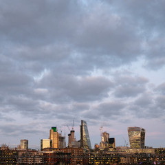 Photo of London City skyline at sunset, taken from The South Bank of the Thames