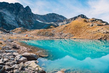 Beautiful turquoise alpine lake. Travels in the mountains