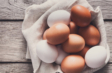 Fresh chicken brown eggs on rustic wood, organic farming concept