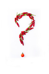 Question made with chillies on a white background