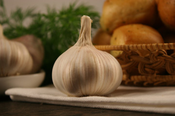 Homemade buns with garlic and dill on wooden table. Selective focus.