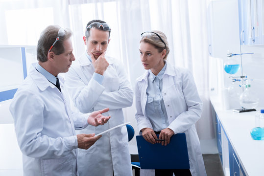 chemists discussing work