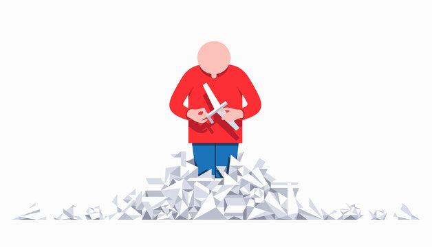 Boy building paper plane from heap of paper