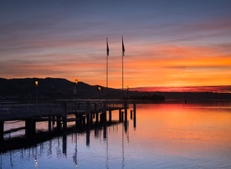 Fototapeta na wymiar Sunset over the shores of the upper Zurich Lake, Rapperswil, Sankt Gallen, Switzerland