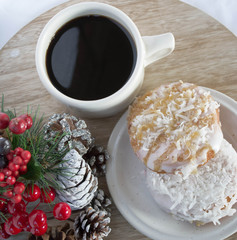 Serving black coffee with sweet donuts
