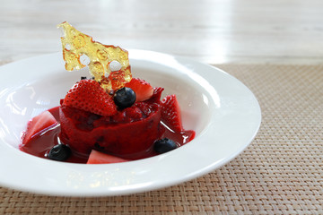 Premium Red velvet cake chocolate lava with fresh strawberry and blueberry  on white dish for celebration event.