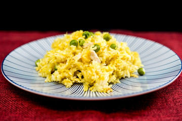 Homemade Chinese fried rice with vegetables and fried eggs