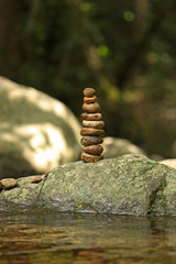 Fototapeta na wymiar Zen Stones outdoors on a Rock with Water