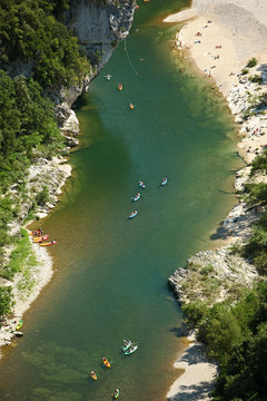 Kayaking on a green River, Shot from above
