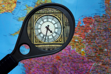 Great Britain and watches Big Ben with a big shot in a magnifier on a map of Europe