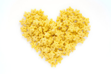 Corn Flakes in the form Heart Isolated Top View on White Background