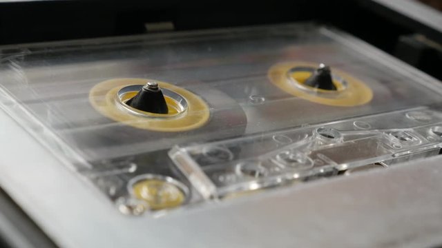  Close-up retro cassette in casettophone footage - Rotation of audio tape player supply spindle