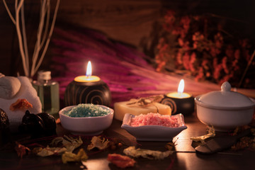 Spa composition with alight candles on wooden background