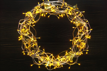 Christmas garland wreath on wood background