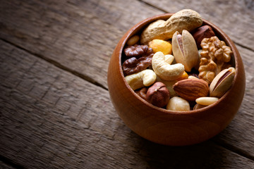 Mixed nuts in wooden bowl