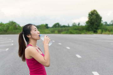 Asian girl drinking water