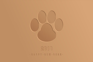 Christmas design concept congratulations in the form of an imprint of a dog paw and inscription 2018 Happy new year.