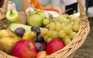 Wooden basket filled with Autumn fruits
