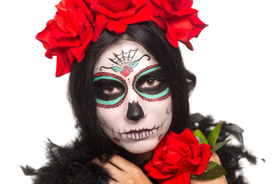 Day of the dead. Halloween. Young woman in day of the dead mask skull face art and rose. Isolated on white. closeup.